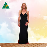 Woman in a black dress standing on a wooden floor with a colorful background and 'Australian Made' logo.