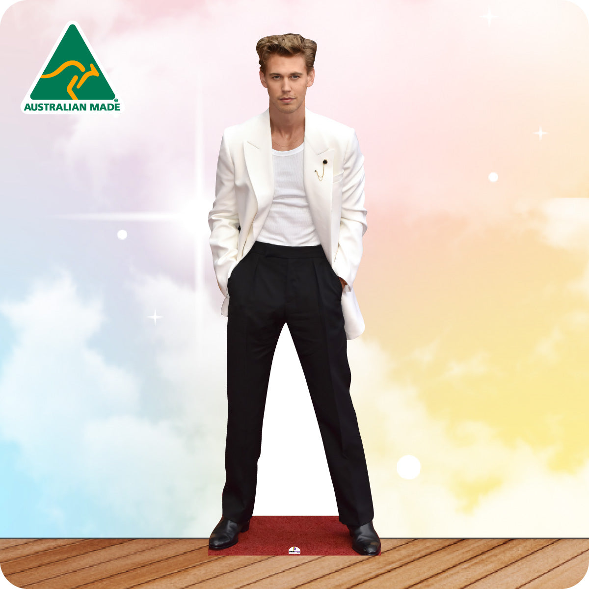 Man in a white jacket and black pants standing on a wooden deck with a colorful background and Australian Made logo.