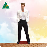 Man in a white jacket and black pants standing on a wooden deck with a colorful background and Australian Made logo.