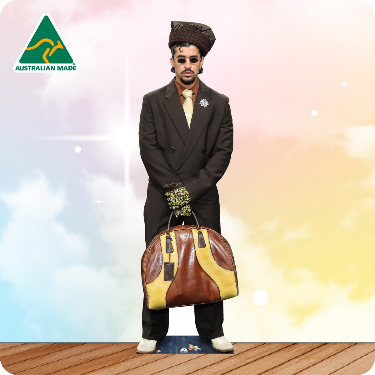 Cardboard cutout of a person in formal attire holding a large bag with 'Australian Made' logo.