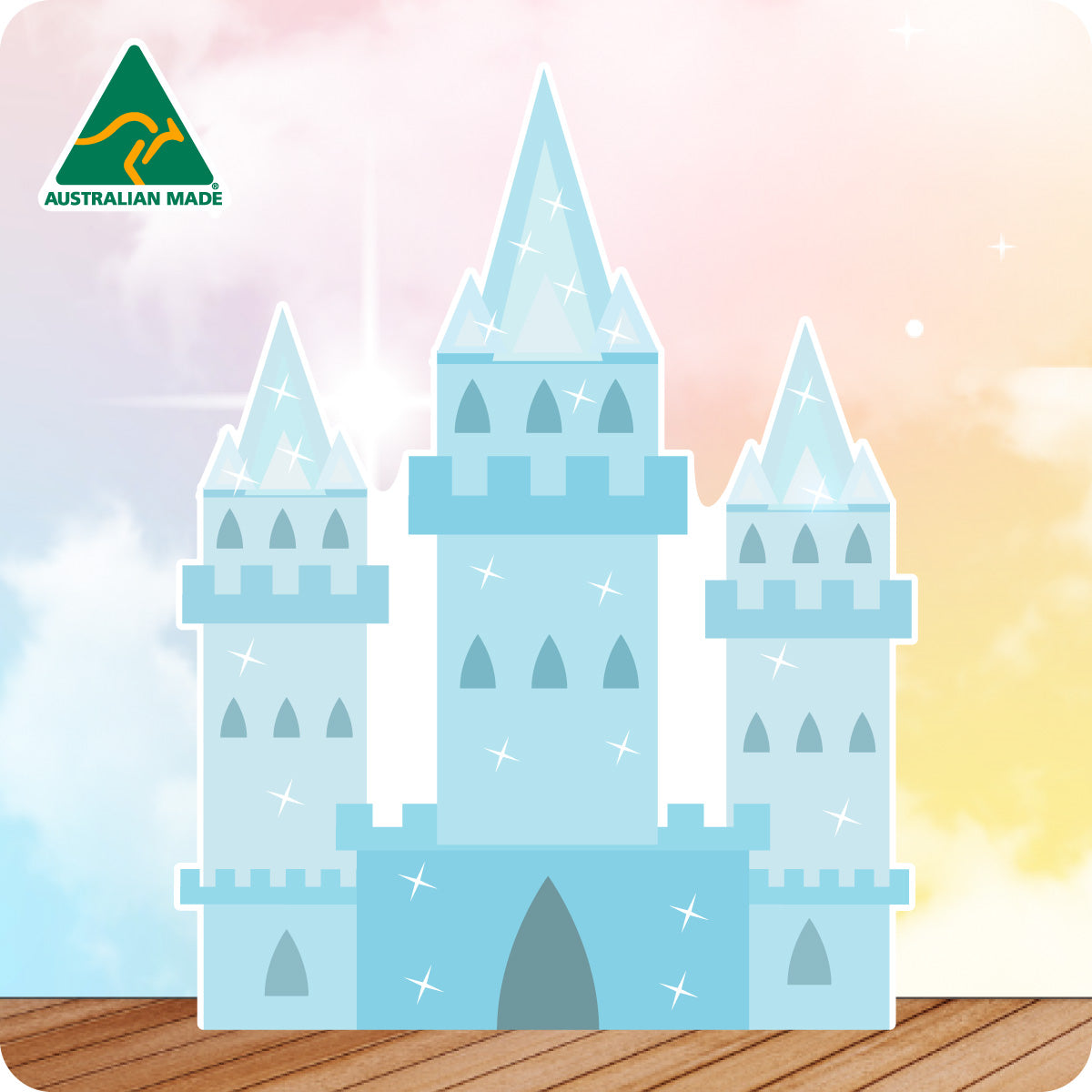 Cardboard cutout of a fairy tale blue castle with 'Australian Made' logo on a gradient background