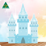 Cardboard cutout of a fairy tale blue castle with 'Australian Made' logo on a gradient background