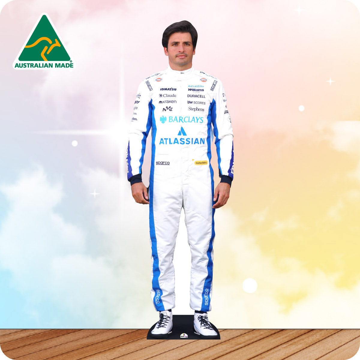Cardboard cutout of a person in a racing suit with sponsor logos on a gradient background