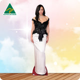 Woman wearing a black and white dress with 'Australian Made' logo in the corner