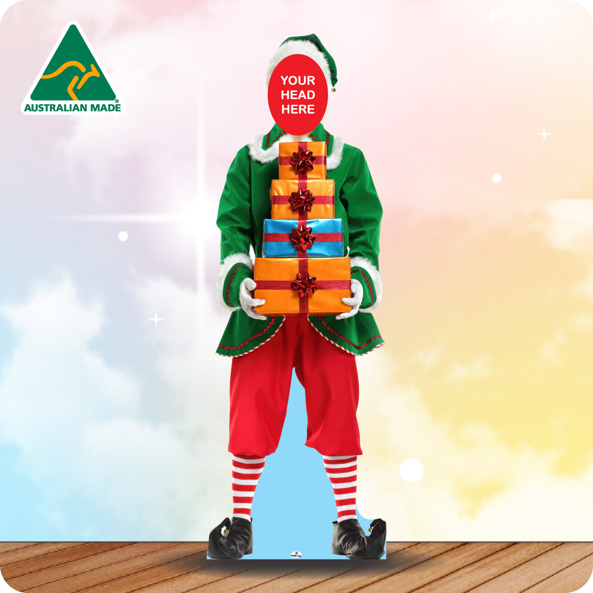 Elf character holding gifts with a 'Your Head Here' placeholder against a blurred background.