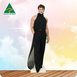 Man wearing a black outfit with a 'Made in Australia' logo on a colorful background