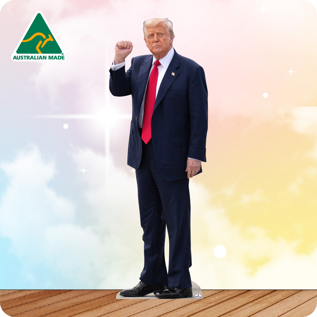 Man in a suit with a red tie standing on a wooden platform, Australian Made logo visible