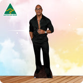 dwayne johnson in a black outfit wearing glassed