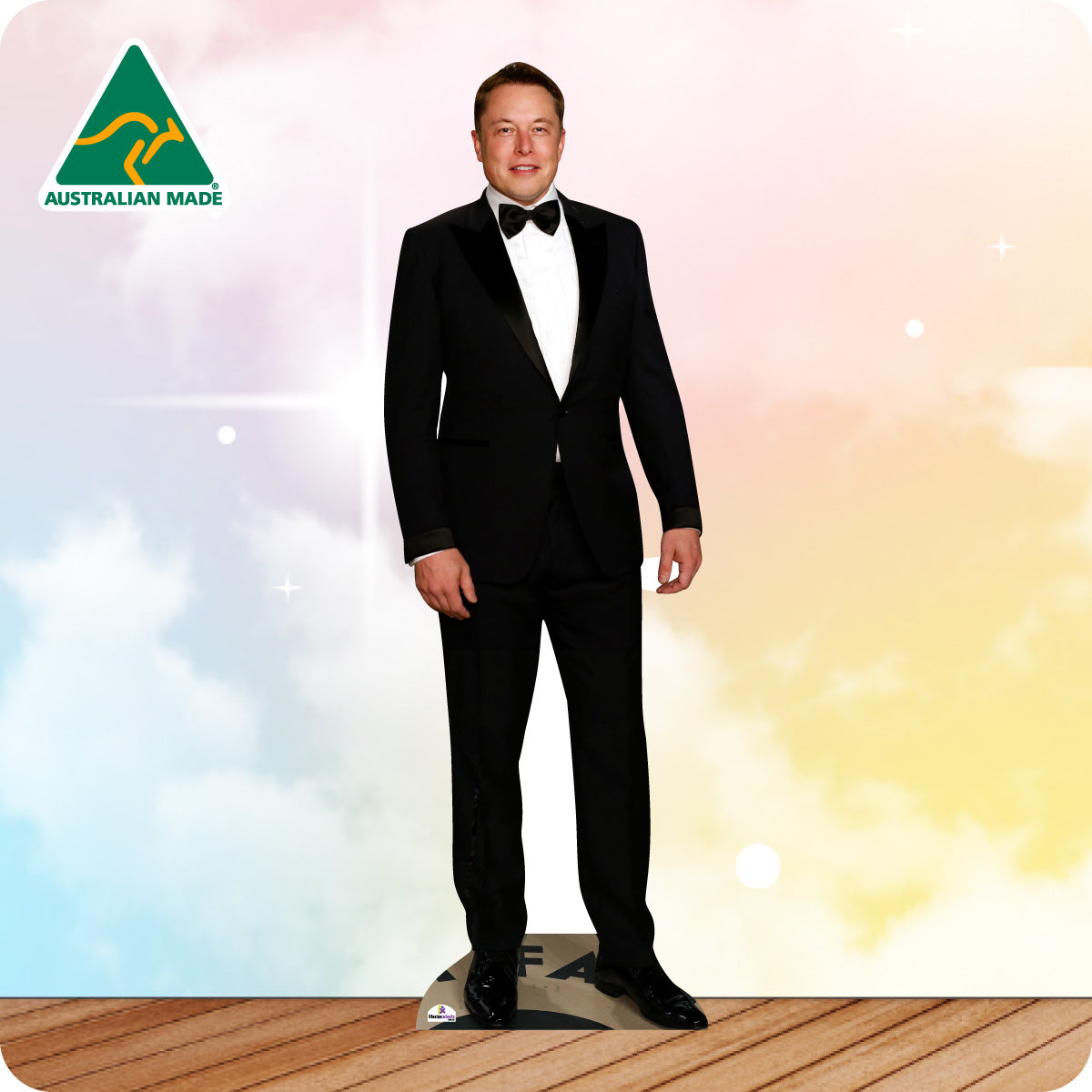 Mannequin in a black suit with bow tie on a wooden floor against a colorful gradient background, featuring 'Australian Made' logo.