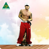 Cardboard cutout of a shirtless man in red pants with 'Australian Made' logo in the corner.