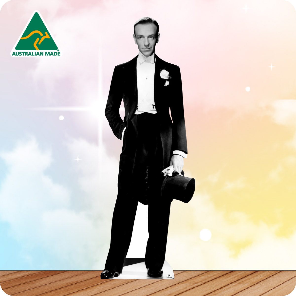 Man in a formal suit with a hat on a gradient background, Australian Made logo visible.