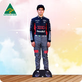 Cardboard cutout of a person in a racing suit with 'Revolut' branding on a gradient background.