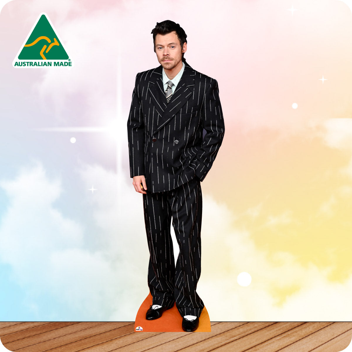 Cardboard cutout of a man in a suit with 'Australian Made' logo on a colorful background