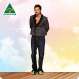 Man wearing a gray blazer and blue jeans on a colorful background with 'Australian Made' logo.
