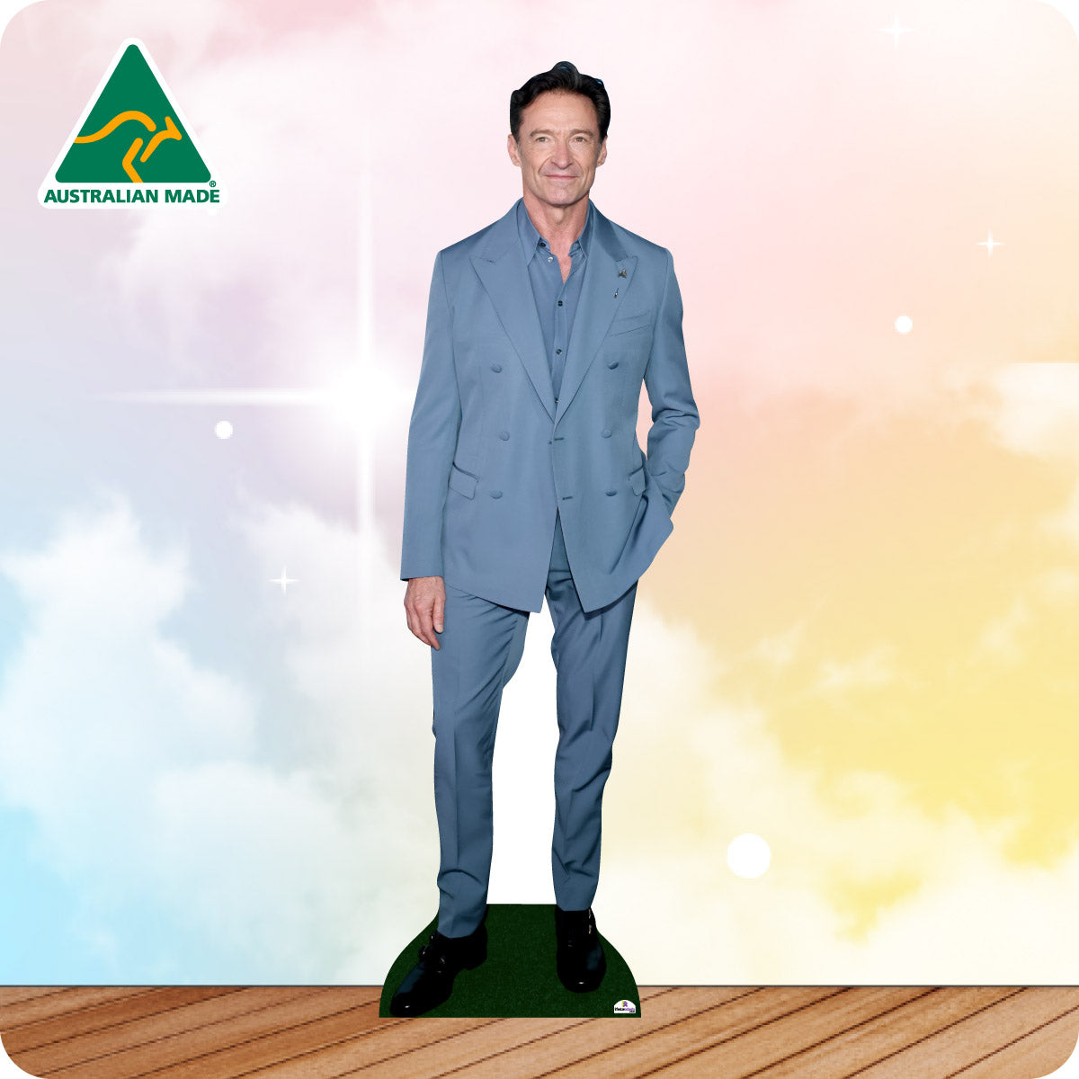 Cardboard cutout of a man in a blue suit with 'Australian Made' logo on a colorful background