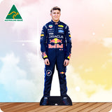 Cardboard cutout of a person in a Red Bull racing suit with a blurred gradient background