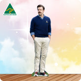 Man wearing a navy sweater and beige pants with a colorful background and 'Australian Made' logo.