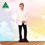 Cardboard cutout of a person in formal attire with 'Australian Made' logo on a colorful background
