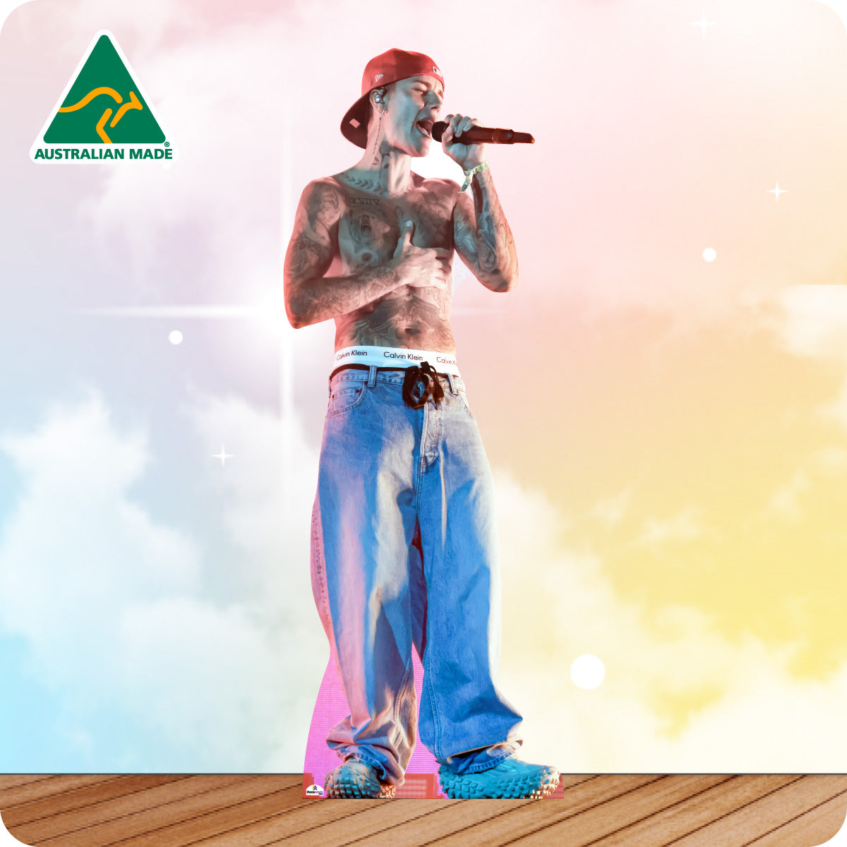 Man singing into a microphone with 'Australian Made' logo in the corner