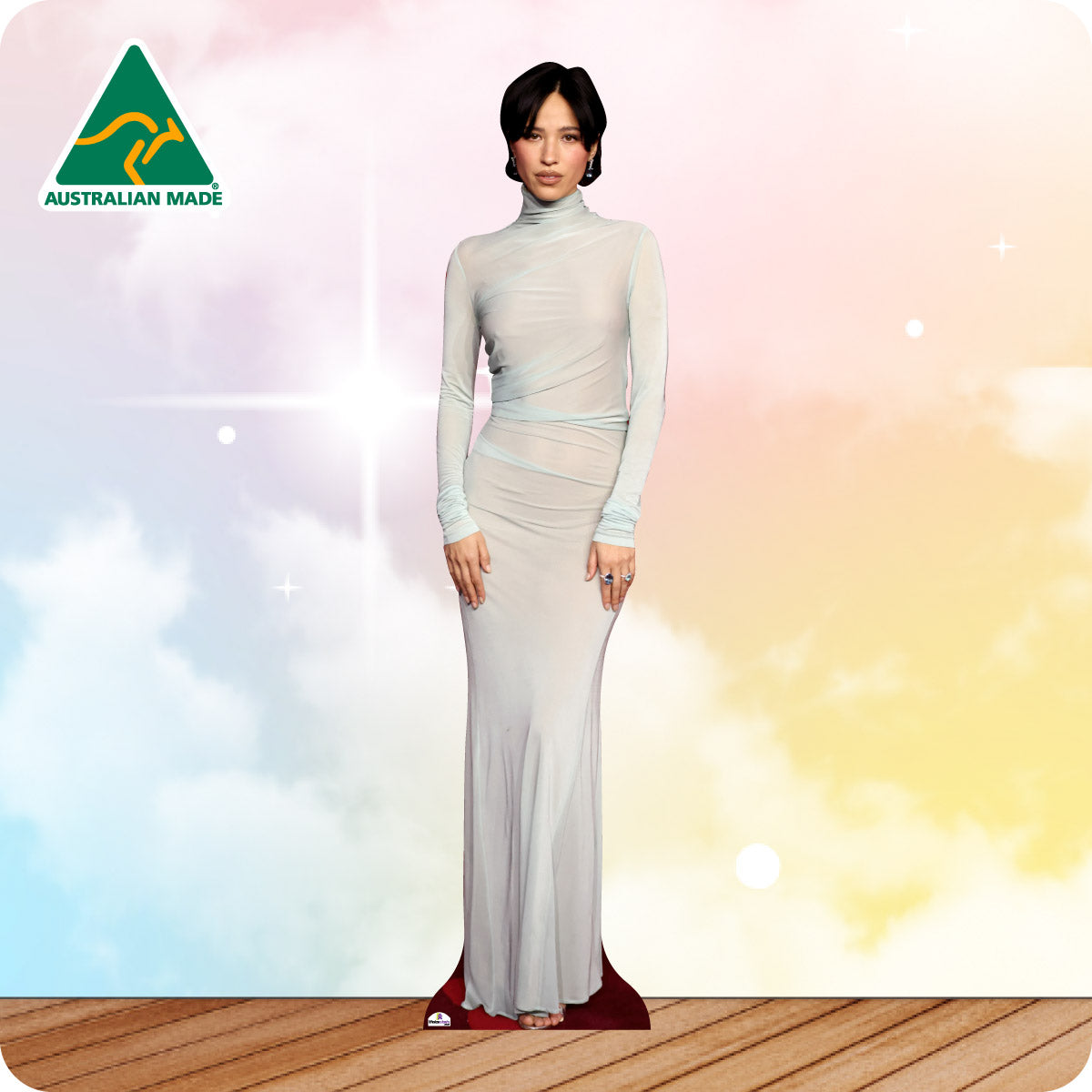 Woman in a white evening gown on a colorful background with 'Australian Made' logo.
