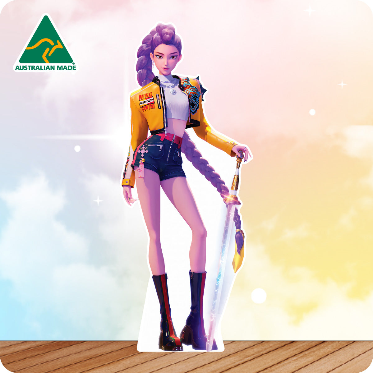 Cardboard cutout of a person in colorful outfit with 'Australian Made' logo on a gradient background