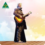 Person playing an acoustic guitar on a wooden deck with a 'Made in Australia' logo in the corner.