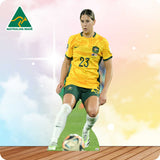Soccer player in a yellow jersey with the number 23 on a grass field, Australian Made logo visible.