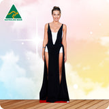 Woman in a black and white dress with a high slit on a colorful background, featuring 'Australian Made' logo.