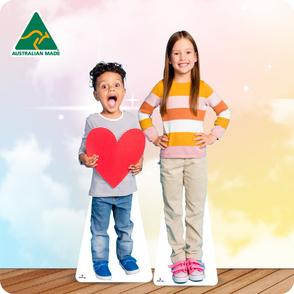 Cardboard cutouts of two children holding a heart, with 'Australian Made' logo in the corner.