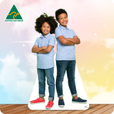 Cardboard cutout of two children wearing matching light blue polos and jeans with 'Australian Made' logo.