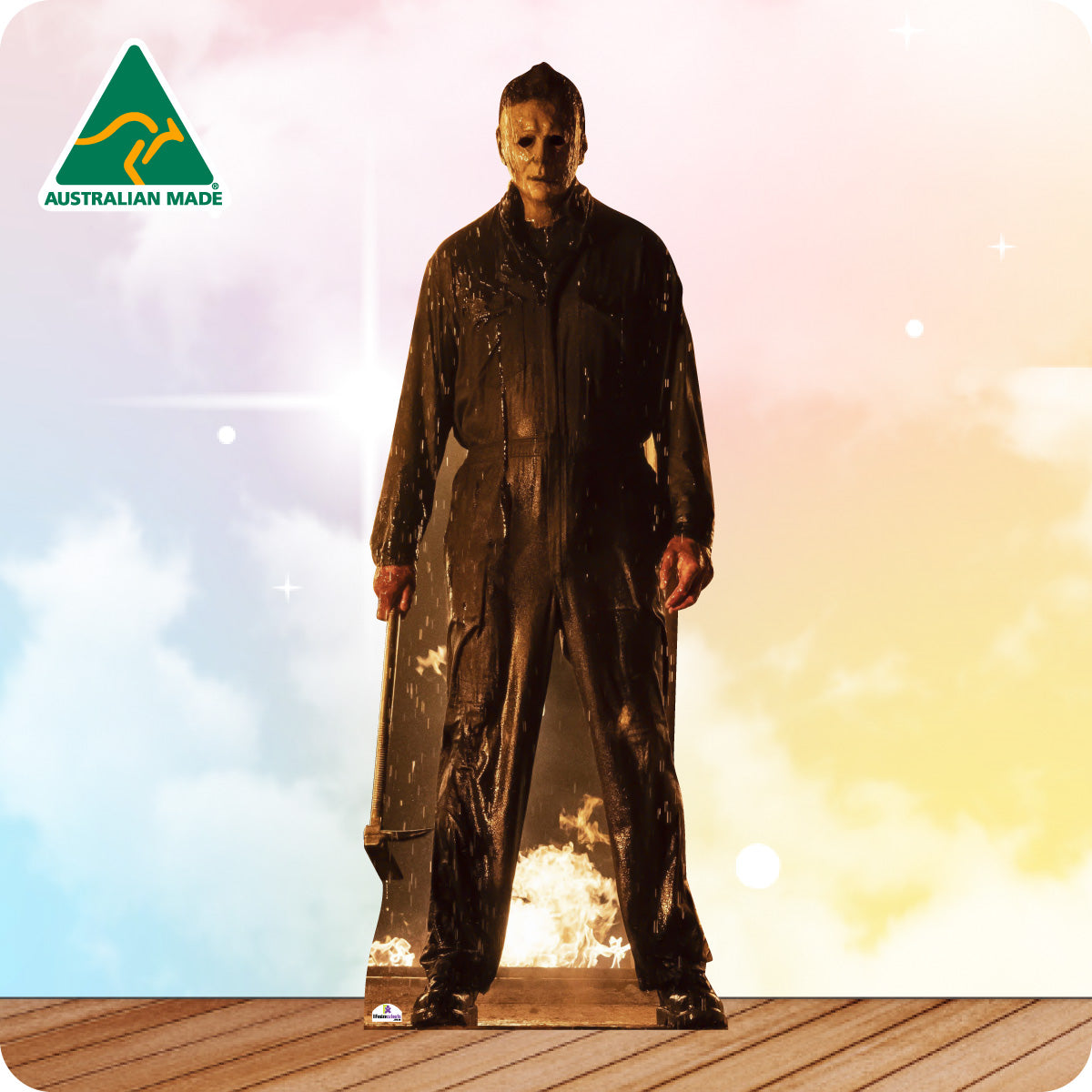 Cardboard cutout of a character in a dark raincoat on a colorful background with 'Australian Made' logo.