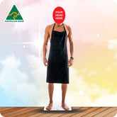 Cardboard standee of a person wearing a black apron with a red circle for customization on a colorful background.