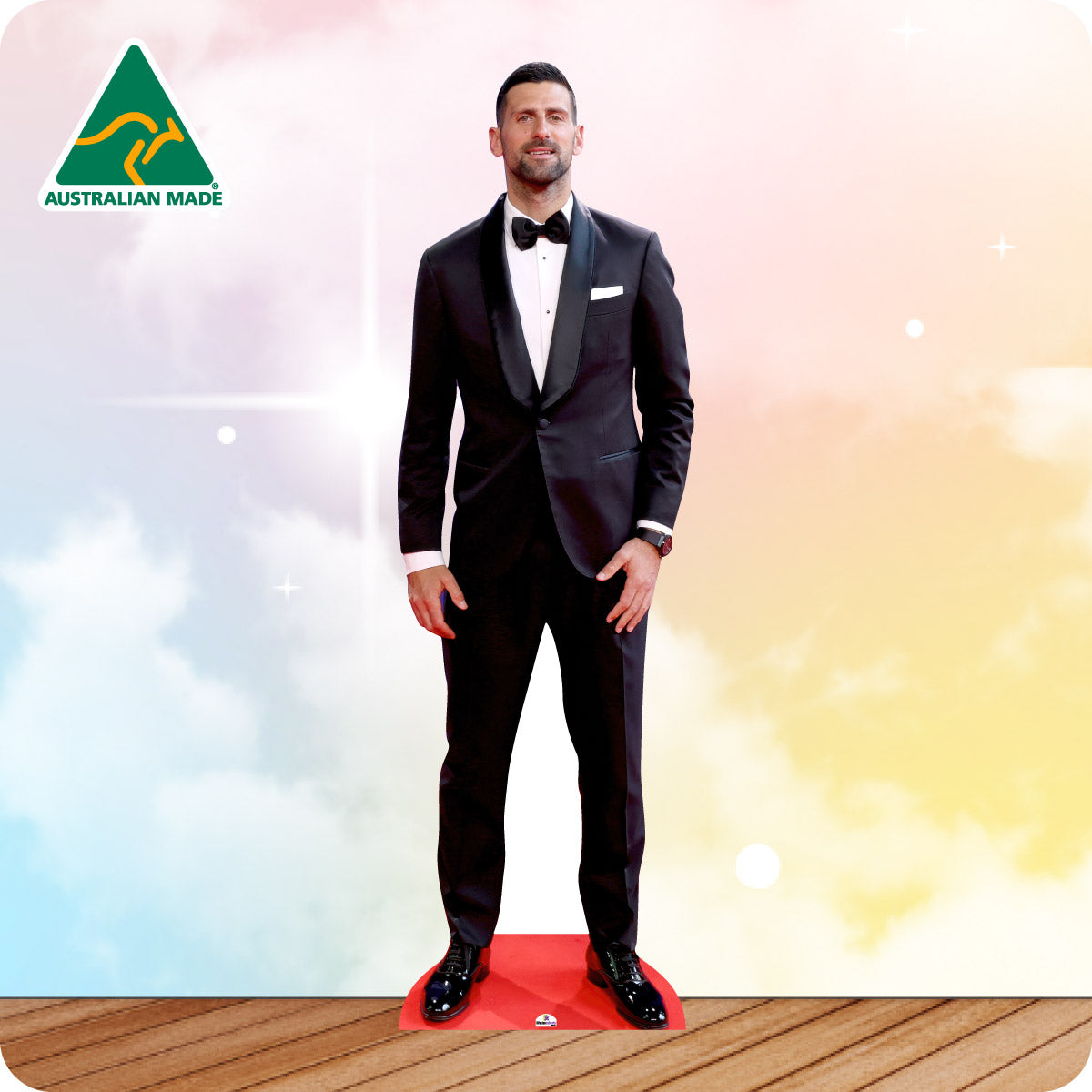 Cardboard standee of a man in a black suit with a bow tie on a colorful background, featuring 'Australian Made' logo.