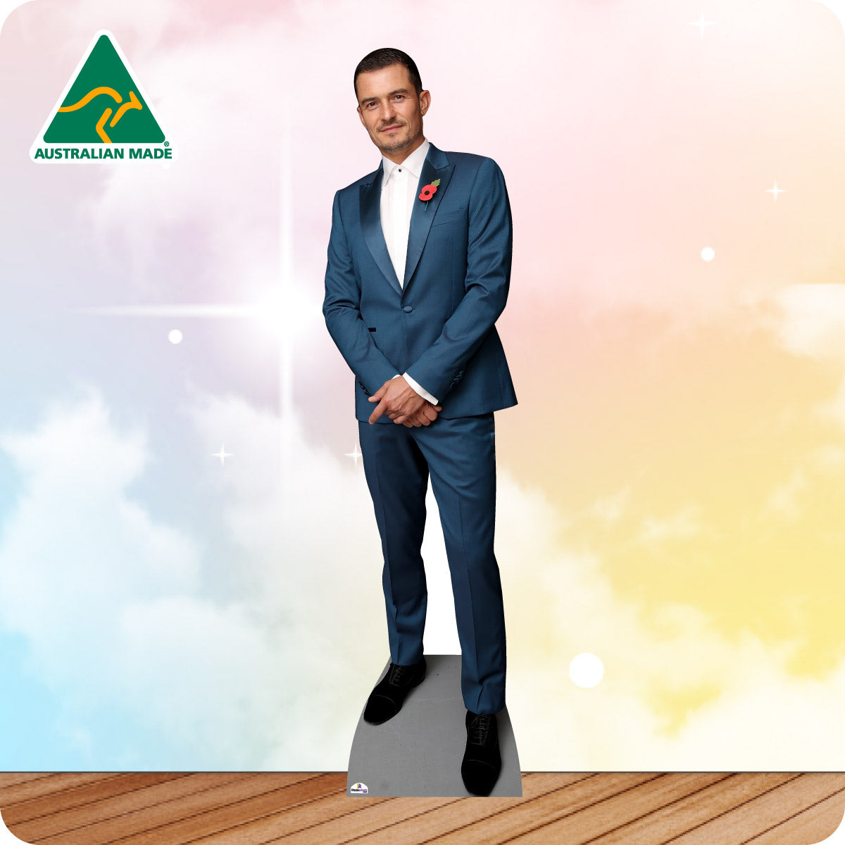 Cardboard cutout of a man in a blue suit with a red poppy against a colorful gradient background, featuring the 'Australian Made' logo.