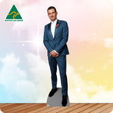 Cardboard cutout of a man in a blue suit with a red poppy against a colorful gradient background, featuring the 'Australian Made' logo.