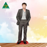 Man wearing a suit with 'Australian Made' logo on a colorful background