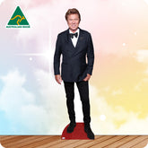 Cardboard standee of a person in a black suit with a bow tie on a colorful background, featuring 'Australian Made' logo.