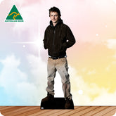 Cardboard standee of a man wearing a black jacket and beige pants on a colorful background with 'Australian Made' logo.
