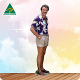 Man in a floral shirt and shorts standing on a wooden deck with a colorful background and 'Australian Made' logo.