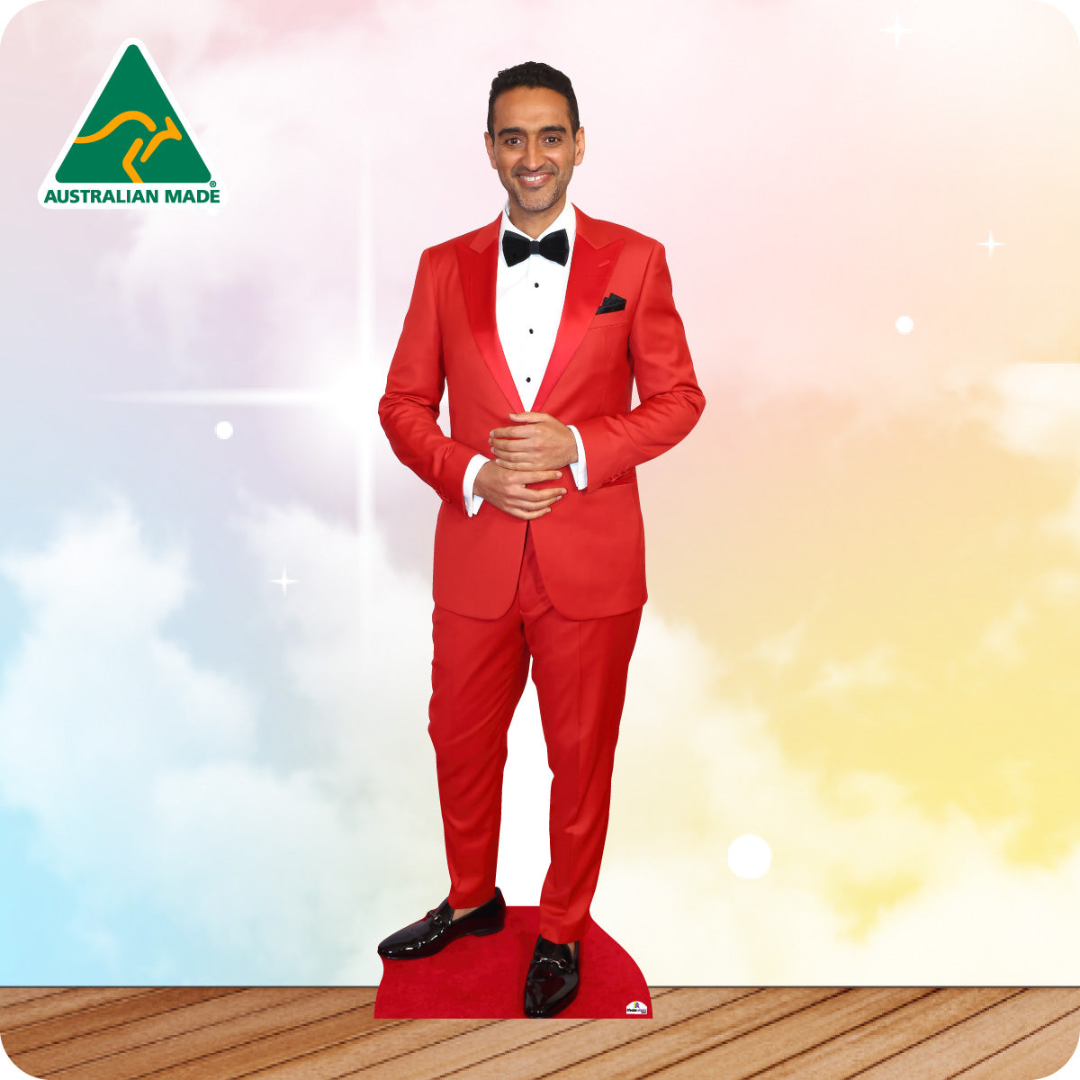 Cardboard standee of a man in a red suit with a colorful background and 'Australian Made' logo.
