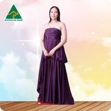 Woman wearing a purple strapless gown against a gradient background with 'Australian Made' logo.