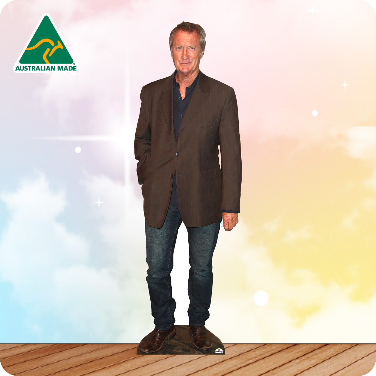 Man wearing a brown blazer over a blue shirt with 'Australian Made' logo on a gradient background