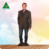 Man wearing a brown blazer over a blue shirt with 'Australian Made' logo on a gradient background