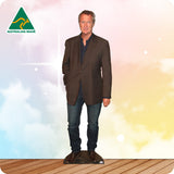 Man wearing a brown blazer over a blue shirt with 'Australian Made' logo on a gradient background