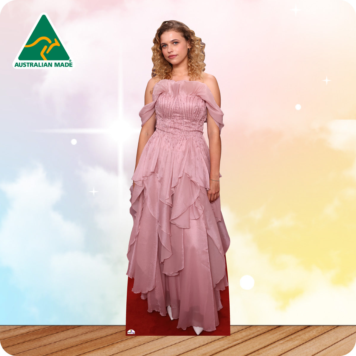 Cardboard cutout of a woman wearing a pink dress with a 'Made in Australia' logo in the corner.