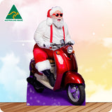 Santa Claus riding a red scooter with an Australian Made logo in the corner.