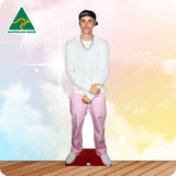 Cardboard cutout of a person wearing a white shirt and pink pants with 'Australian Made' logo in the corner.