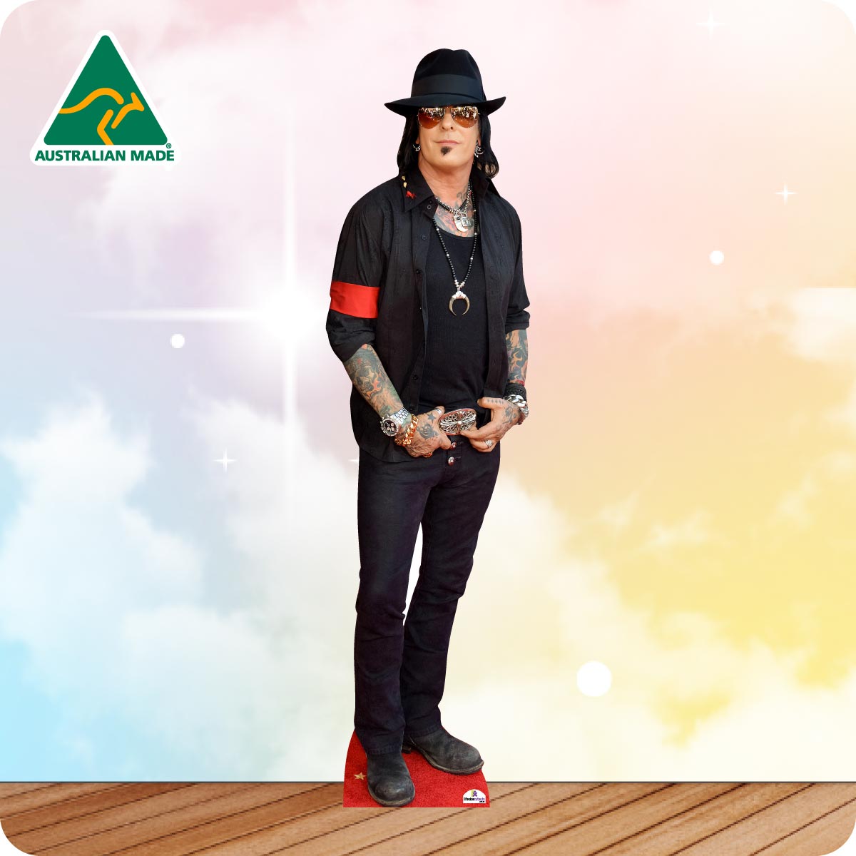 Life-size Nikki Sixx cutout wearing a black leather jacket, black jeans, boots and silver jewellery.
