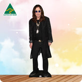Ozzy Osbourne Ina n all black outfit with purple glasses