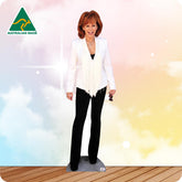 Life-size Reba McEntire cutout wearing a black embellished jacket, black trousers and black heels.